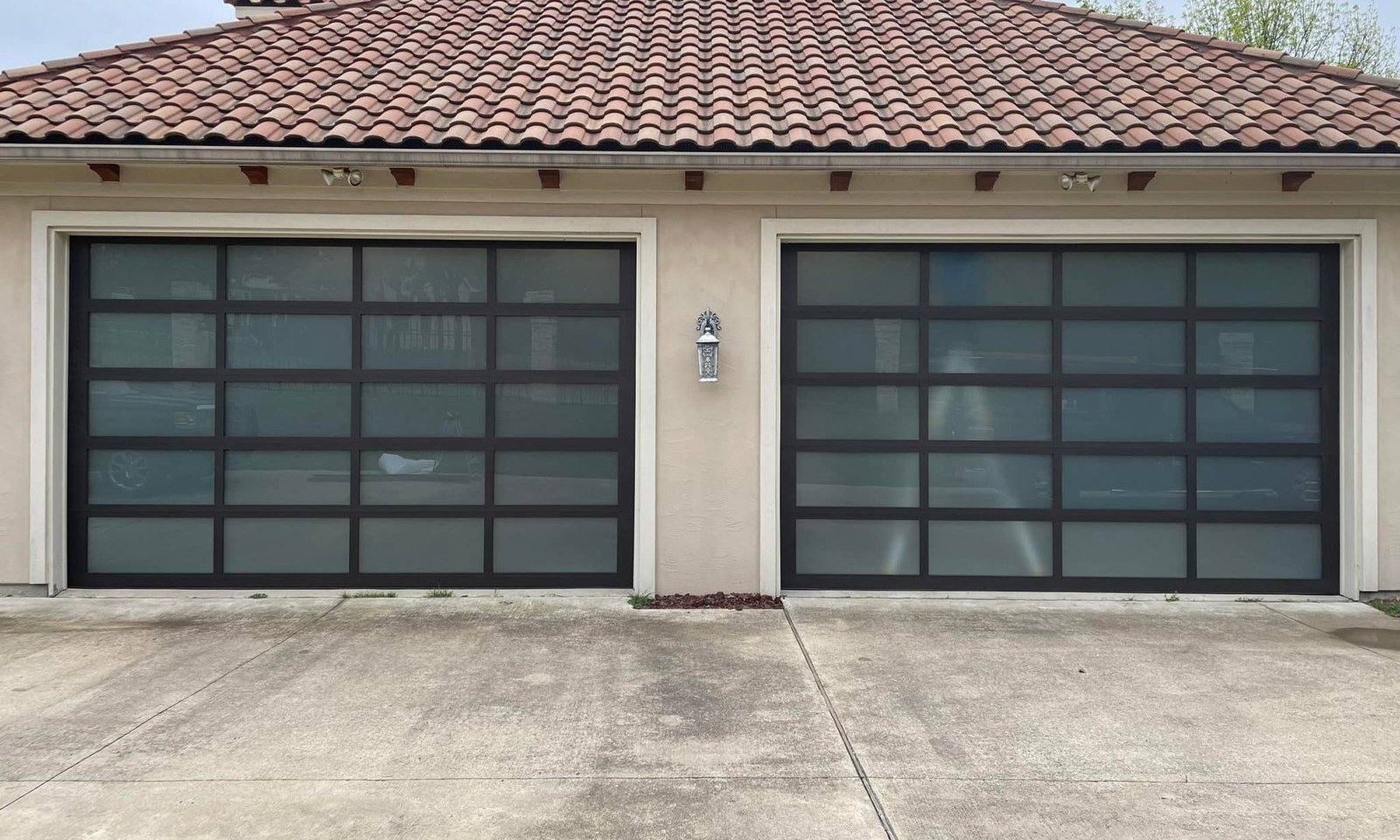 Full-view glass garage doors on a Plano TX home