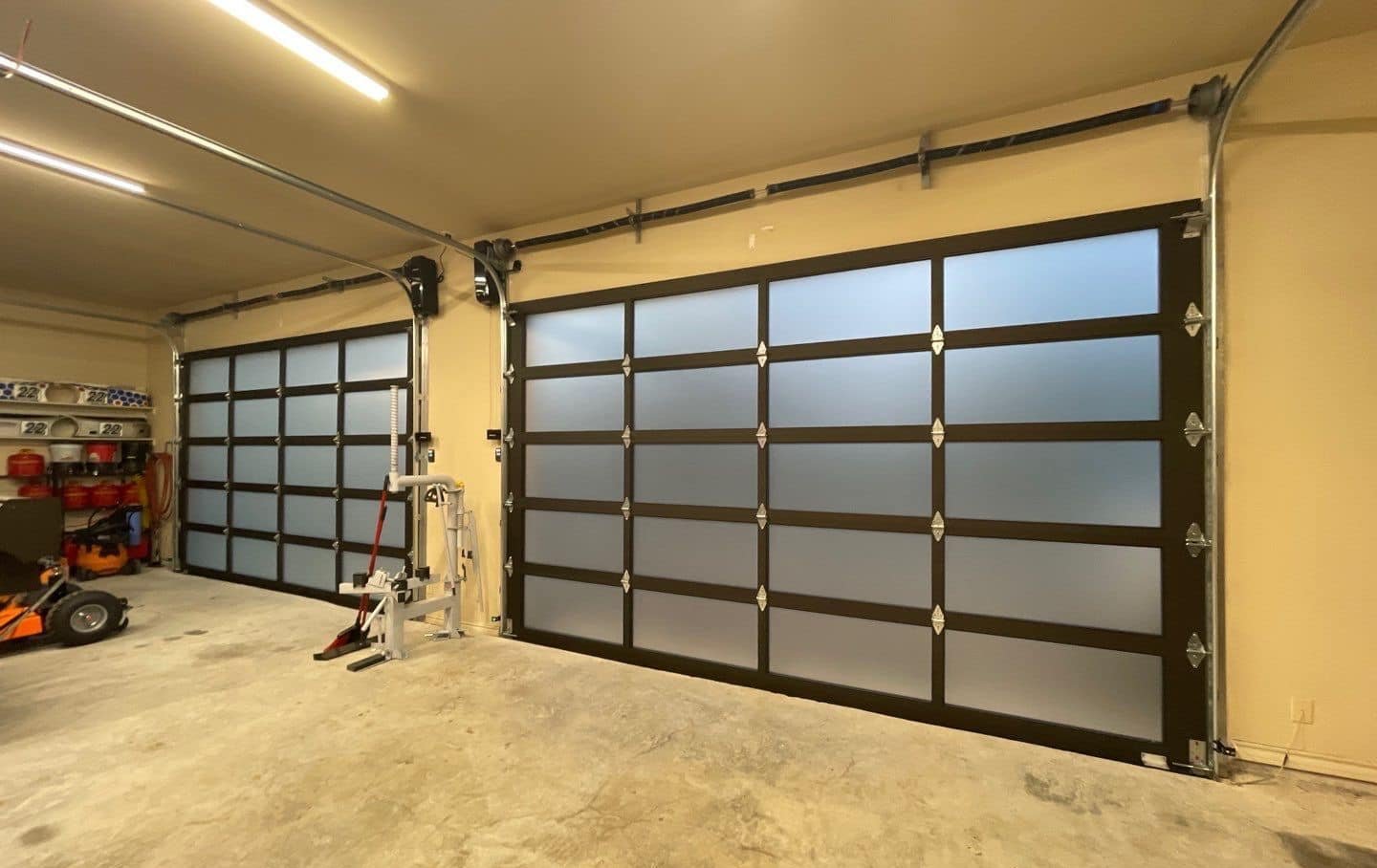 Garage door springs and opener rail fitted on a Plano home